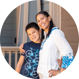 Habitat GSF homeowner with her son standing outside their home