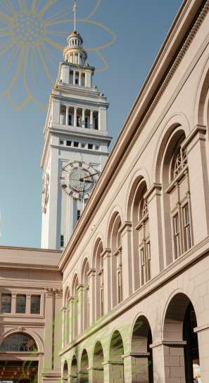 San Francisco Ferry Building shot from below with a clear blue sky behind.