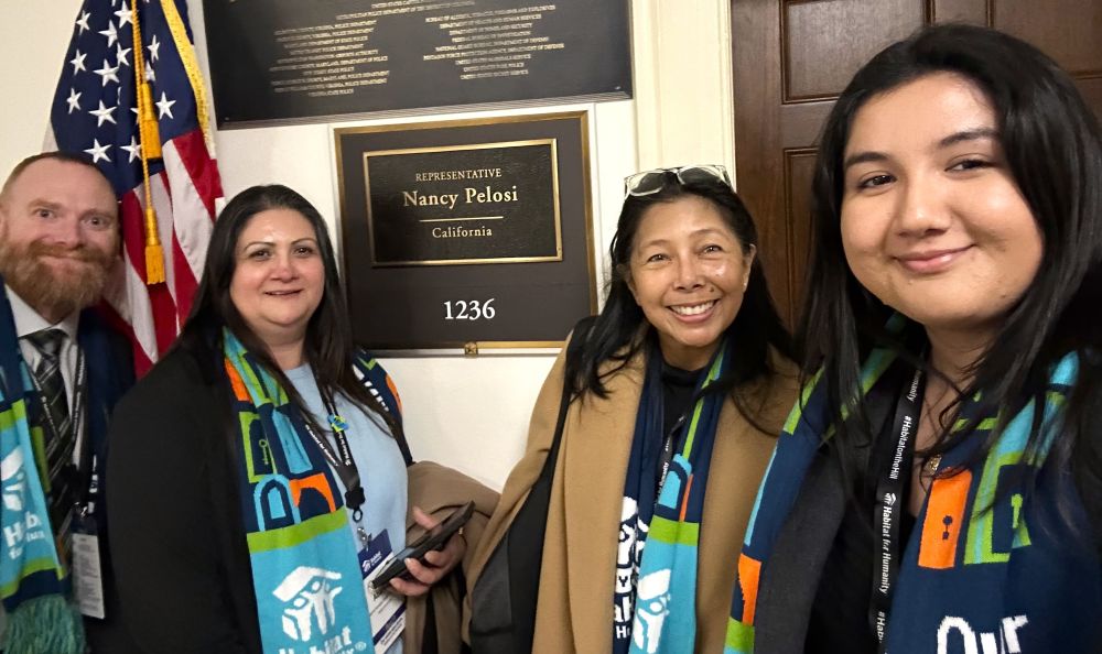 4 people smiling for a selfie
