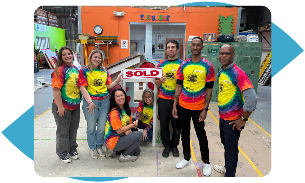 Build with Pride volunteers smiling and posing